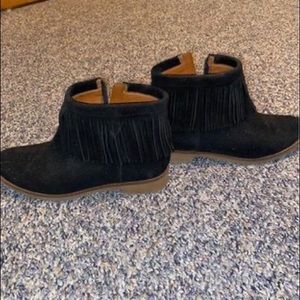 Fringed ankle booties with zipper on the side